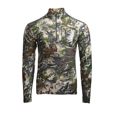SKRE merino wool hunting baselayer top worn in alpine backcountry conditions
